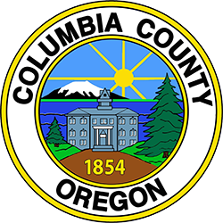 Columbia County logo is drawing of courthouse with mountain, sun and lake behind. Fir trees flank the building with a road leading up. Year 1854 placed in path.